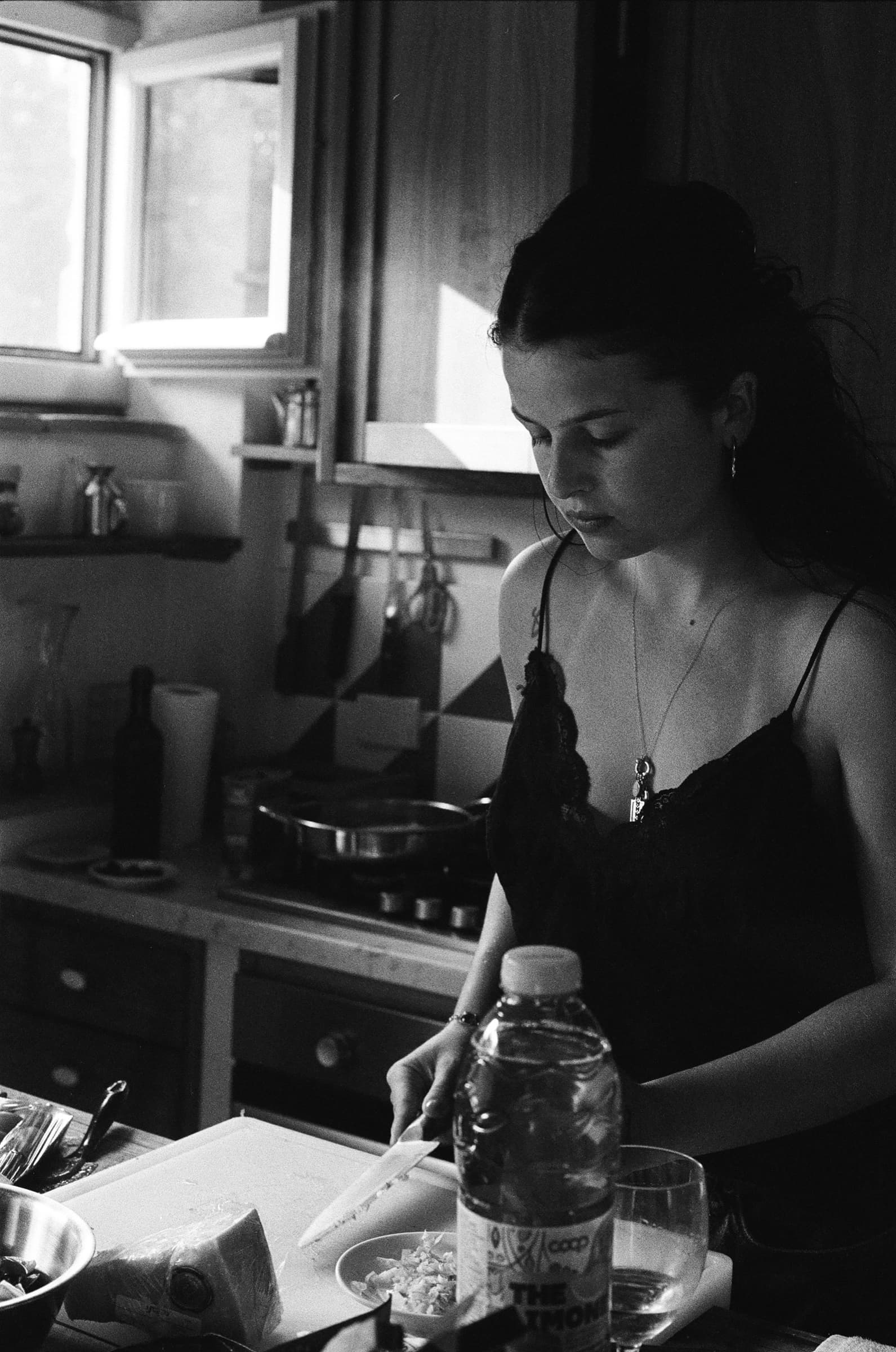 A black-and-white kitchen portrait during prep
