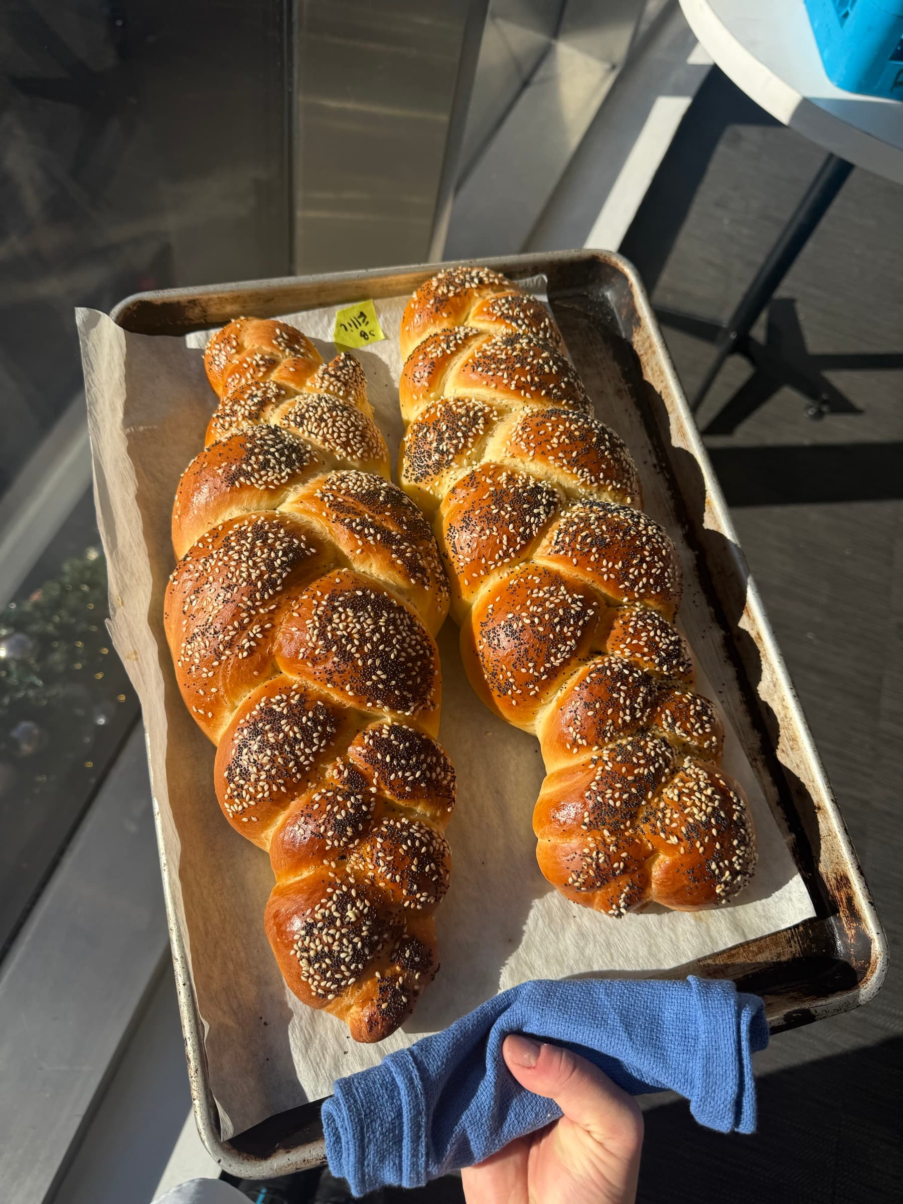 Braided loaves cooling on a sheet pan